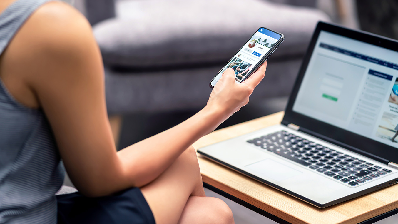 Public relations fellow working on social media content