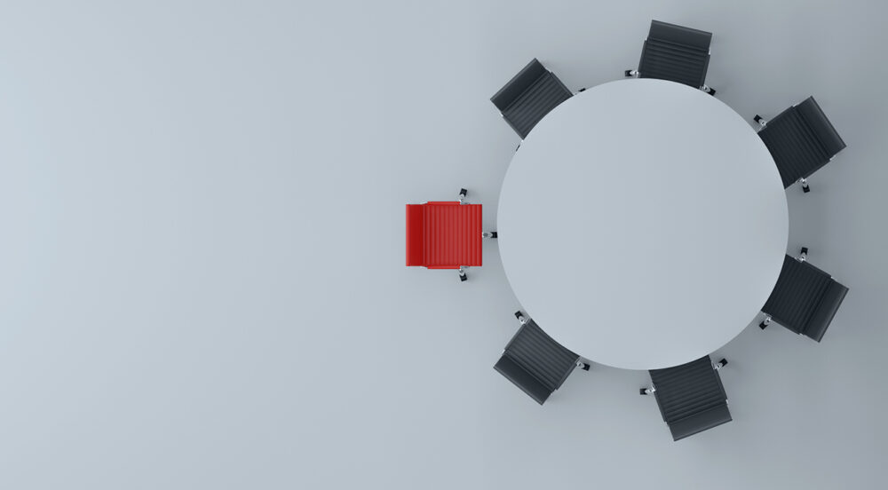 Chairs around a table for a blog on the communications strategy of joining an association