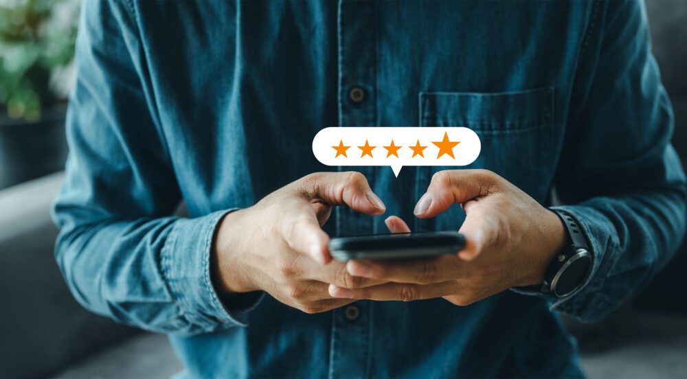 Man using smartphone for customer satisfaction survey